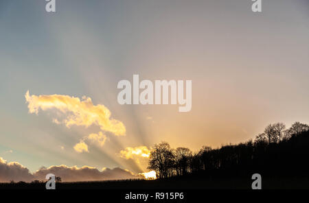 Clouds radiating beams of diffused light, Surrey Hills, Surrey, England, UK. Stock Photo