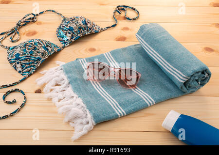Handwoven hammam Turkish cotton towel on wooden background Stock Photo