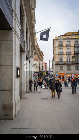 Madrid, Spain - December 2018: Apple Store located in puerta del Sol, with pedestrians passing by outside the store. Stock Photo