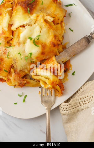 Italian-American cuisine baked ziti lasagna with mozzarella cheese Stock Photo