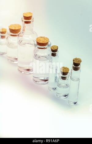 Close up glass measuring beakers for science experiment background Stock Photo