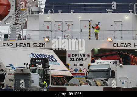 A firefighter takes a photograph of toppled lorries on board the European Causeway, a P&O Ferry which was travelling from Larne in Northern Ireland to Cairnryan Ferry Terminal, Wigtownshire, when it was caught in high winds. Stock Photo