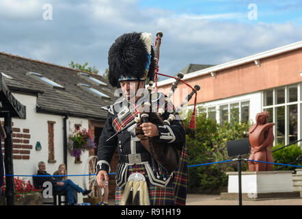 Piper in traditional scottish kilt, Gretna Green, Scotland, United Kingdom Stock Photo