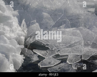 Detail of jagged plates of broken ice piled along the shore of Lake Superior in Northern Minnesota. Stock Photo