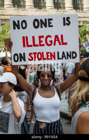 "Families Belong Together" protesters in Chicago's Daley Plaza on a sweltering Saturday, June 30th, 2018 Stock Photo