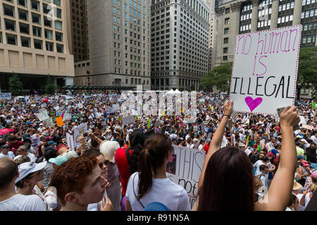 "Families Belong Together" protesters in Chicago's Daley Plaza on a sweltering Saturday, June 30th, 2018 Stock Photo