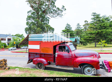 MONTEVIDEO, URUGUAY, USA - DECEMBER 12, 2017: Red truck on the road. With selective focus Stock Photo