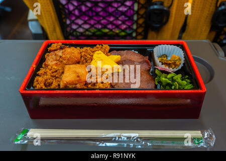 Tokyo, Japan - April 22 2018: Japanese Eki Bento (meal) on a Shinkansen Train Stock Photo