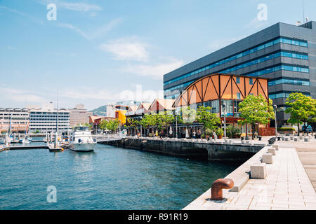Nagasaki, Japan - May 25, 2015 : Dejima Wharf shopping and restaurant street with sea Stock Photo