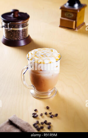 ice caramel macchiato on a wooden table Stock Photo