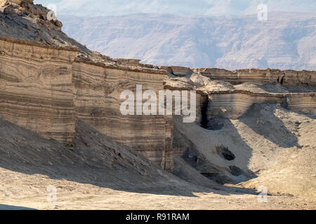 Marl stone formations. Eroded cliffs made of marl. Marl is a calcium carbonate-rich, mudstone formed from sedimentary deposits. Photographed in Israel Stock Photo