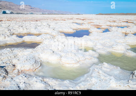 Salt formation caused by the evaporation of the water on the shore of the Dead Sea, Israel Stock Photo