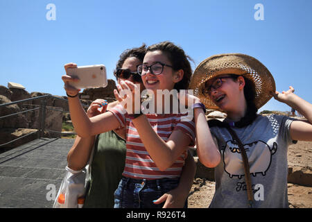 Attica Greece Cape Sounion Mother and Daughters taking Selfie with Smartphone Stock Photo
