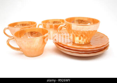 Vintage 1950's Anchor Hocking Fire King Swirl  Peach Lustre 4 Cups  & 4 Saucers American  USA Stock Photo