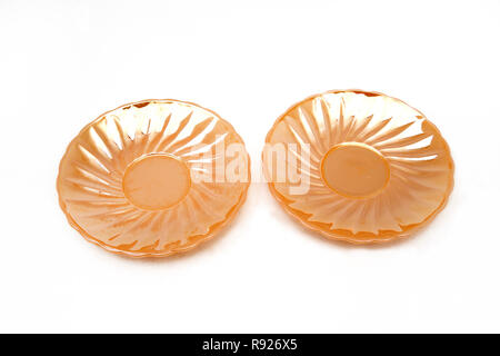 Vintage 1950's Anchor Hocking Fire King Swirl  Peach Lustre 2 Saucers American  USA Stock Photo