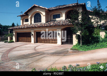 Spanish revival house in San Diego has a circular driveway and four car garage, California, USA Stock Photo