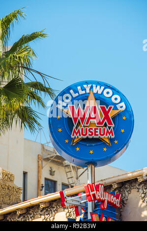 HOLLYWOOD, CALIFORNIA, USA - FEBRUARY 6, 2018: View of the sign 'Wax Museum' against the blue sky. Vertical Stock Photo
