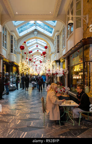 Shoppers walkling through the historic (1819) Burlington Arcade in Mayfair, central London, England, UK. Stock Photo