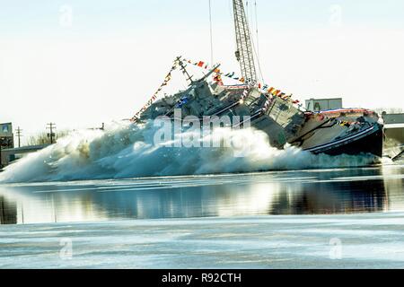 The U.S. Navy future littoral combat ship USS St. Louis launches sideways into the Menominee River following the christening December 15, 2018 in Marinette, Wisconsin. Once commissioned, it will be the seventh ship to bear the name St. Louis over the history of the U.S. Navy. Stock Photo