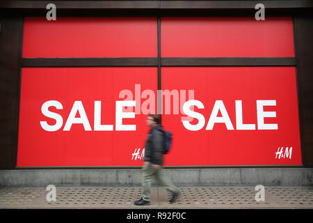 London, UK. 18th December, 2018. The crisis on Britain’s high streets is to intensify this Christmas, with shopkeepers preparing themselves for the quietest festive period since the credit crunch, according to forecasts. Many stores around the country have taken to slashing their prices and starting their sales early such as these in Londons Oxford Street. Credit: Nigel Bowles/Alamy Live News Stock Photo