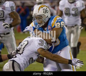 Oakland, California, USA. 14th Sep, 2009. Oakland Raiders cornerback Tyvon Branch #33 tackles San Diego Chargers tight end Brandon Manumaleuna #86 on Monday, September 14, 2009, at Oakland-Alameda County Coliseum in Oakland, California. The Chargers defeated the Raiders 20-24. Credit: Al Golub/ZUMA Wire/Alamy Live News Stock Photo