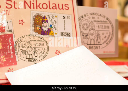 St. Nikolaus, Germany. 18th Dec, 2018. A letter in Braille is next to the special postmark of the Santa Claus post office in Saarland. This year Nikolaus from Saarland answered for the first time visually impaired children in Braille. Credit: Oliver Dietze/dpa/Alamy Live News Stock Photo