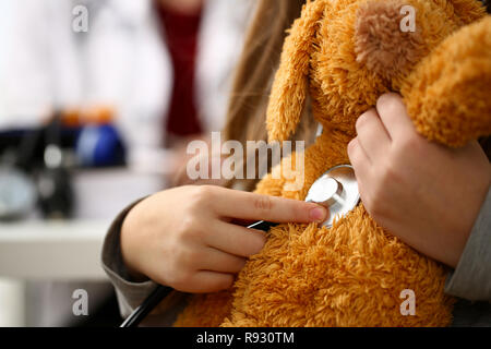 Female hand of little girl hold stethoscope listen Stock Photo