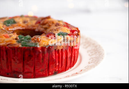 Round Fruit Cake with Cherries Pineapples and Nuts Elegant Platter Stock Photo