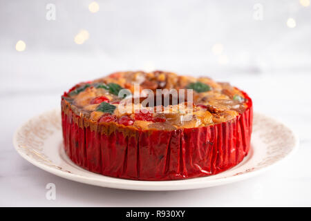 Round Fruit Cake with Cherries Pineapples and Nuts Elegant Platter Stock Photo