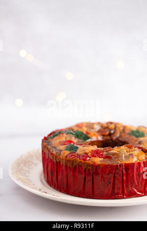 Round Fruit Cake with Cherries Pineapples and Nuts Elegant Platter Stock Photo