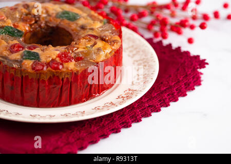 Round Fruit Cake with Cherries Pineapples and Nuts Elegant Platter Stock Photo