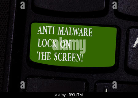 Word writing text Anti Malware Lock On The Screen. Business concept for Security safety against malware hacking Keyboard key Intention to create compu Stock Photo