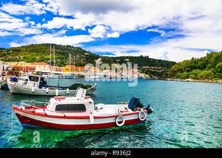 Turquoise sea and traditional boats in Lakka village,Paxos island,Greece. Stock Photo