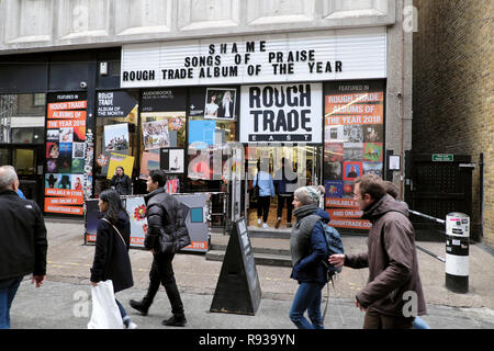 Rough Trade East music store exterior and people pedestrians walking past record shop store near Brick Lane in East London UK  KATHY DEWITT Stock Photo