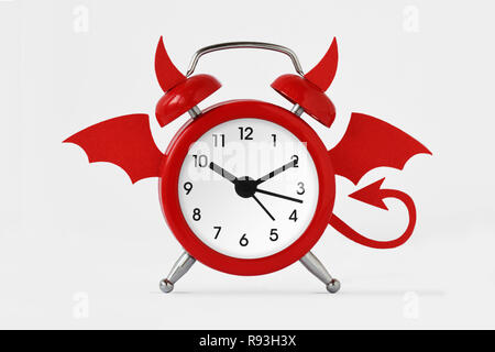 Devil alarm clock on white background Stock Photo
