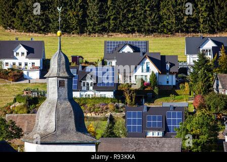 Solar panels on the roofs of residential houses, Oberkirchen, North Rhine-Westphalia Stock Photo