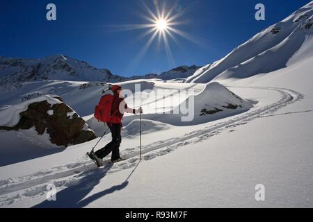 Ski tour, female ski tour hiker in ascent, ascent track, behind it Sonnenstern, Verwall, district Bludenz, Vorarlberg, Austria Stock Photo
