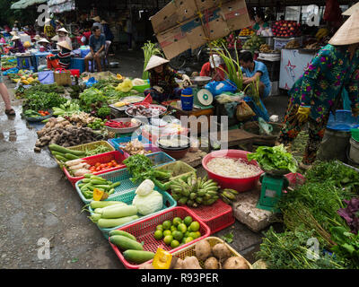 Fresh Fruit and vegetables laid out on the ground displayed for sale Can Tho  City outdoor market Vietnam Asia Stock Photo