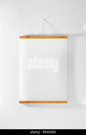 Wood frame poster hanging on wall Stock Photo