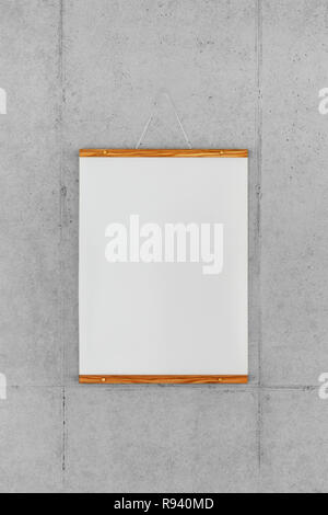 Wood frame poster hanging on wall Stock Photo
