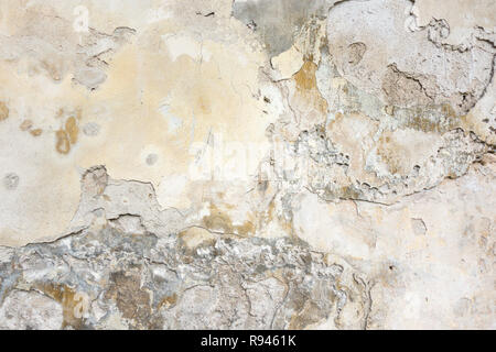 Old Wall With Peel Grey Stucco Texture. Retro Vintage Worn Wall Background. Decayed Cracked Rough Abstract Wall Surface Stock Photo