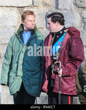 Olivia Colman, Josh O'Connor and Tobias Menzies film a scene for the Netflix drama at Caernarfon Castle. The Queen presents the newly invested Prince of Wales to the Welsh people from Queen Eleanor's Gate.  Featuring: Ben Daniels, Josh O'Connor Where: Caernafon, United Kingdom When: 18 Nov 2018 Credit: WENN.com