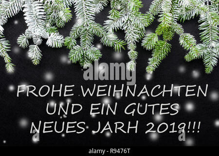 Fir tree and snow on dark background. Greetings Christmas card. Postcard. Christmastime. White and green.' frohe weihnachten und ein gutes neues jahr 
