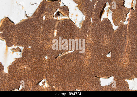 white paint peeling in rusty metal, white paint peeling on old rusty metal, rusty white metal background Stock Photo
