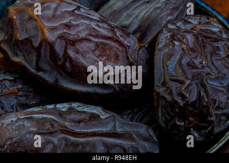 big beautiful dates in cup close-up Stock Photo