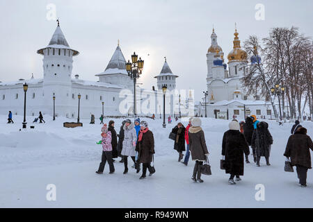 Tobolsk, Russia - January 7, 2015: People at Gostiny Dvor and St. Sophia-Assumption Cathedral in the Tobolsk Kremlin. Built in XVII-XVIII centuries, i Stock Photo