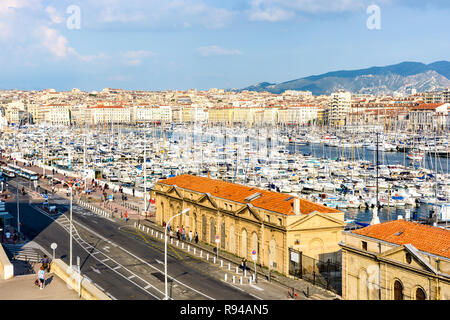 View over the Old Port of Marseille, France, with motorboats and sailboats moored in the marina at sunset. Stock Photo