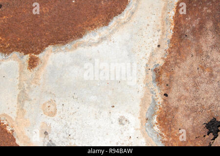 iron white wall with rust, old peeling white paint on rough and rusty corroded metal surface, rusty painted metal surface abstract background and text Stock Photo