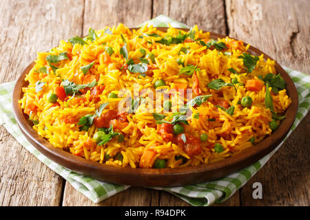 Delicious Indian food Mumbai style rice with vegetables close-up on a plate on the table. horizontal Stock Photo