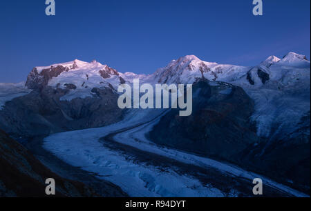 Night view of the Monte Rosa mountain massif, seen from the famous Gornergrat near Zermatt, Switzerland. Stock Photo